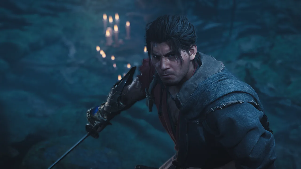 Onimusha: Way of the Sword'da Oni Gauntlet'i takmış Miyamoto Musashi, mum ışığıyla aydınlanan karanlık bir mağarada kılıcını çekmiş halde